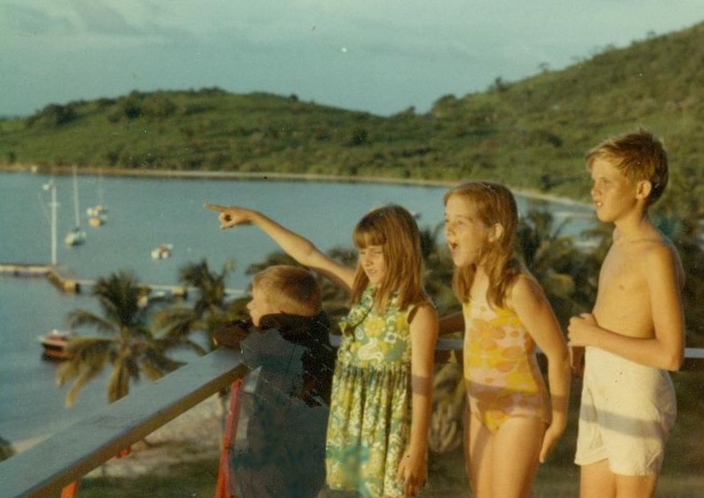Patty points to a tourist attraction on the island of St. Croix. Each of these four children saw a living pterosaur earlier, in Cuba.